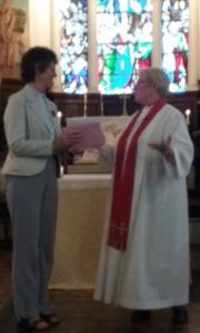 Revd Jeanette presenting Revd Lesley with cards and presents
